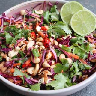 Thai salad with chickpeas, red cabbage, carrots and tahin garlic dressing