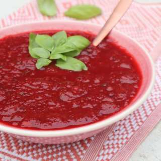 Red beet soup with tomatoes and basil