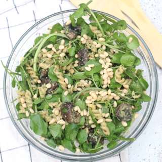 Pasta salad with mushrooms, watercress and pine nuts