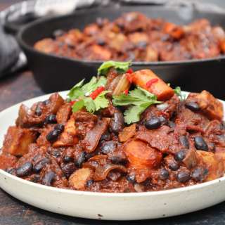 Mexican black bean stew with sweet potato, carrots in tomato sauce