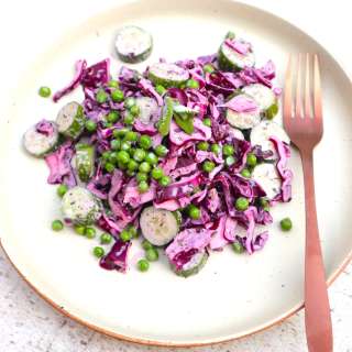 Red cabbage salad with green peas, cucumber, lime and mint