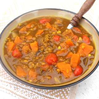 Sweet potato soup with chickpeas, tomatoes and turmeric