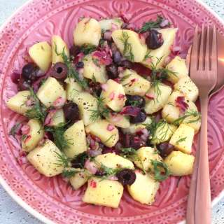Greek potato salad with homemade mustard honey dressing, olives and dill