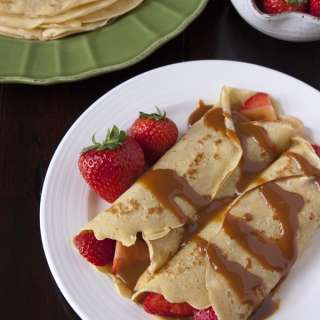 Strawberry-Filled Crepes topped with Boozy Dulce de Leche