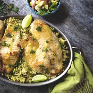 Pan Fried Tilapia over Green Rice topped with Mango and Avocado Salsa