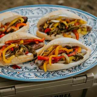 Grilled Beer Brats with Onions, Bell Peppers & Roasted Green Chile