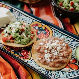 Vegetarian Mexican Tostadas with Refried Beans and Guacamole