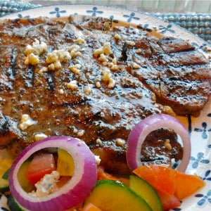 Greek Seasoned Porterhouse Steak with Cucumber and Tomato Salad