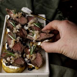 Venison Crostini with Whipped Goat Cheese & Pickled Shallots