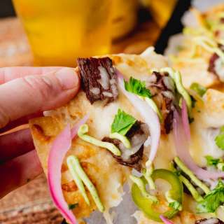 Elk Steak Nachos with Avocado Crema