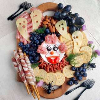 Scare up Some Snacks with A Halloween Pennywise Charcuterie Board
