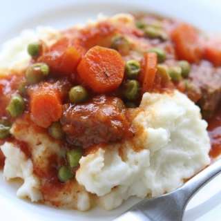 Swiss Steak Over Mashed Potatoes