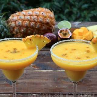 Tropical margaritas with pineapple, passion fruit, and mango