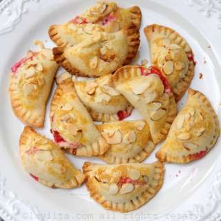 Raspberry, goat cheese and almond empanadas