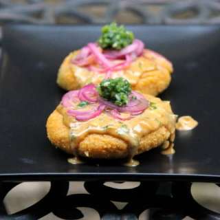 Llapingachos de mote or hominy corn patties