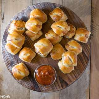 Mini pork, apple & sage sausage rolls with curry ketchup