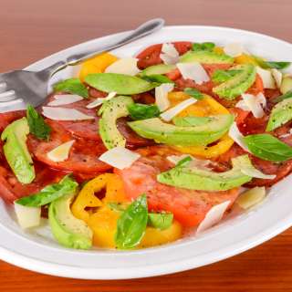 Sliced Heirloom Tomato and Avocado Salad with Basil and Shaved Parmesan