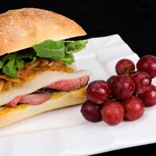Roast Beef, Caramelized Onion, Havarti, and Arugula Sandwich on a Focaccia Roll