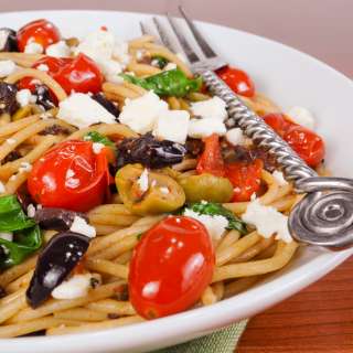 Spaghetti with Tapenade, Tomatoes, Spinach, Arugula, and Feta