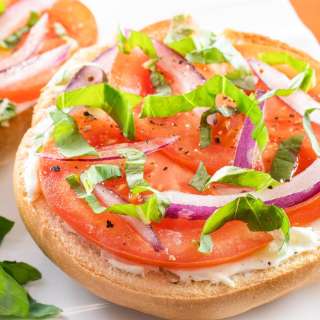 Open-Faced Bagel with Cream Cheese, Tomato, Red Onion, and Fresh Basil