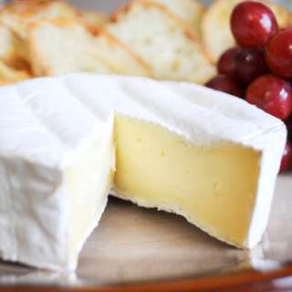 Brie served with Crostini and Grapes