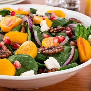 Spinach Salad with Persimmons, Pomegranate Seeds, and Candied Pecans