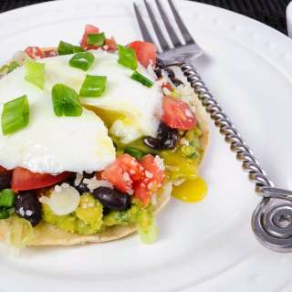 Breakfast Tostada with Guacamole, Black Beans, and Poached Egg