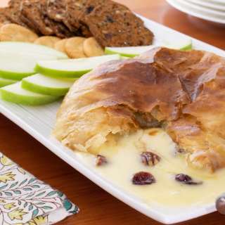 Baked Brie en Croute (with Honey, Candied Pecans and Cranberries)
