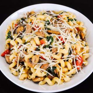 Cavatappi Pasta with Turkey Italian Sausage, Mushrooms, Tomatoes, and Kale