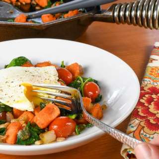 Sweet Potato, Spinach, Farro, and Poached Egg Breakfast Bowl