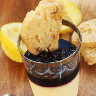 Lemon posset with blueberries & macadamia shortbread