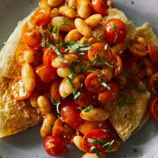 Oat Crepes with Harissa Beans and Tomatoes