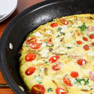 Baked Spanish Tortilla with Potato, Bell Pepper, Onion, Kale, Tomato, and Feta