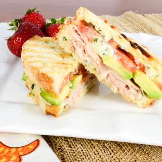 Turkey, Extra Sharp Cheddar, Tomato, and Avocado Panini with Basil Mayonnaise