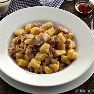 Saffron Potato Gnocchi with Sausage and Porcini