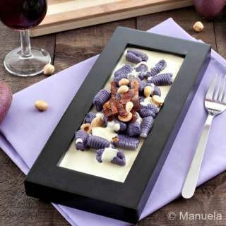 Purple Gnocchi on a Parmigiano Reggiano Fondue with Toasted Hazelnuts and Crunchy Speck