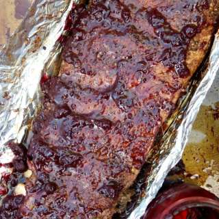 Easy Oven Baked Ribs with Blueberry Bourbon Sauce