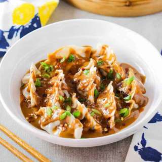 Pork Dumplings with Spicy Peanut Sauce