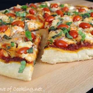Pizza with Ricotta, Grape Tomatoes, Red Onion, and Fresh Basil
