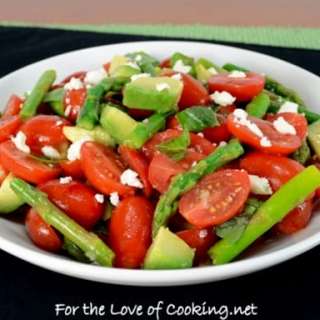 Cherry Tomato, Asparagus, and Avocado Salad Topped with Basil and Feta