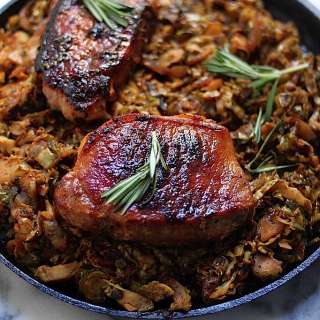 Brown Sugar Rosemary Porks Chops with Caramelized Brussels Spouts, Onion, and Apple Slaw