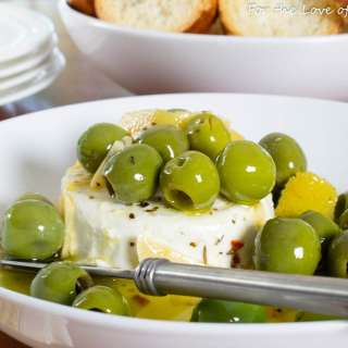 Marinated Olives & Goat Cheese with Garlic Crostini