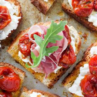 Bruschetta with Rosemary, Roasted Tomatoes, Ricotta, and Prosciutto