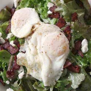 Mixed Green Salad with Bacon, Goat Cheese, and Fried Egg