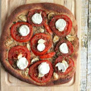 Tomato Garlic Coconut Mozzarella on 100% Whole Wheat crust Pizza. vegan recipe