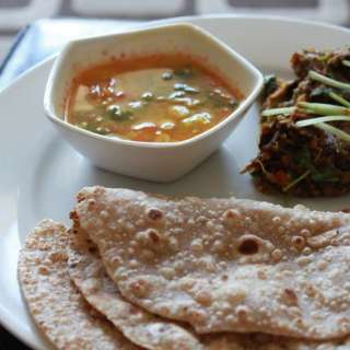 Baingan Bharta, Sambhar, Roti And Papad (Roasted Mashed Eggplant, Pigeon Pea Curry, Indian Flat Bread And Lentil Chips)