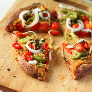 Chana Masala Hummus, cherry tomatoes, Veggies Rustic Pizza. vegan