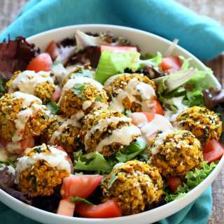 Turmeric Lentil Fritters Tomato Bowl with Tahini Dill Sauce