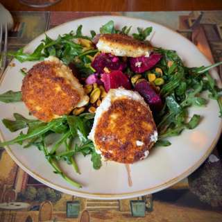 Arugula Salad with Roasted Beets, Pistachios and Goat Cheese Medallions