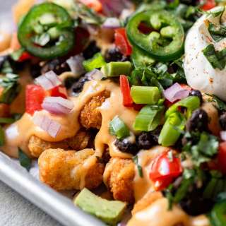 Loaded Totchos with Black Beans and Nacho Cheese Sauce